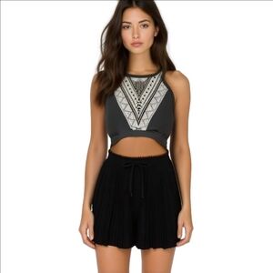 Stand Out This Summer in our Black and White Geometric High Neck Swim Top